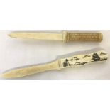 2 decorative bone letter openers. One with engraved ship detail to handle.