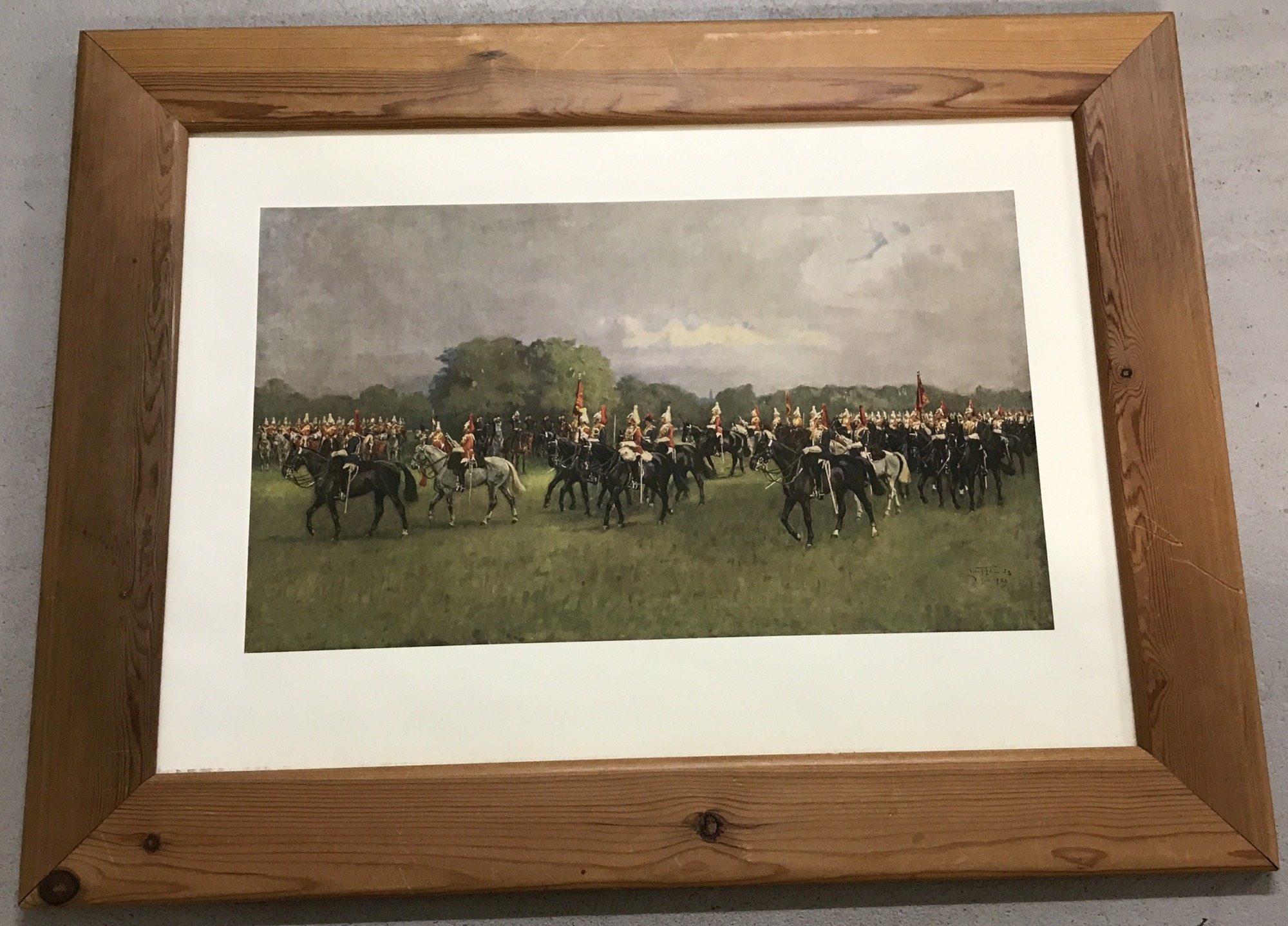 A pine framed colour military print entitled "Trooping the Colour".