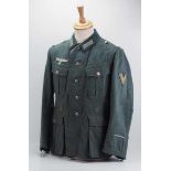 4.1.) Uniformen / KopfbedeckungenWehrmacht: Feldbluse Mannschaften der Panzertruppe.Feldgraues Tuch,