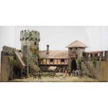 7.3.) SpielzeugDiorama einer Ritterburg.Modell einer Burg mit Personenstaffage, mit