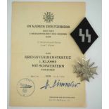 Kriegsverdienstkreuz, 1. Klasse mit Schwertern und Urkunde für einen SS Hauptsturmführer.