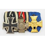 Ordenschnalle eines Polizisten mit 3 Auszeichnungen.1.) Preussen: Eisernes Kreuz, 1914, 2. Klasse,