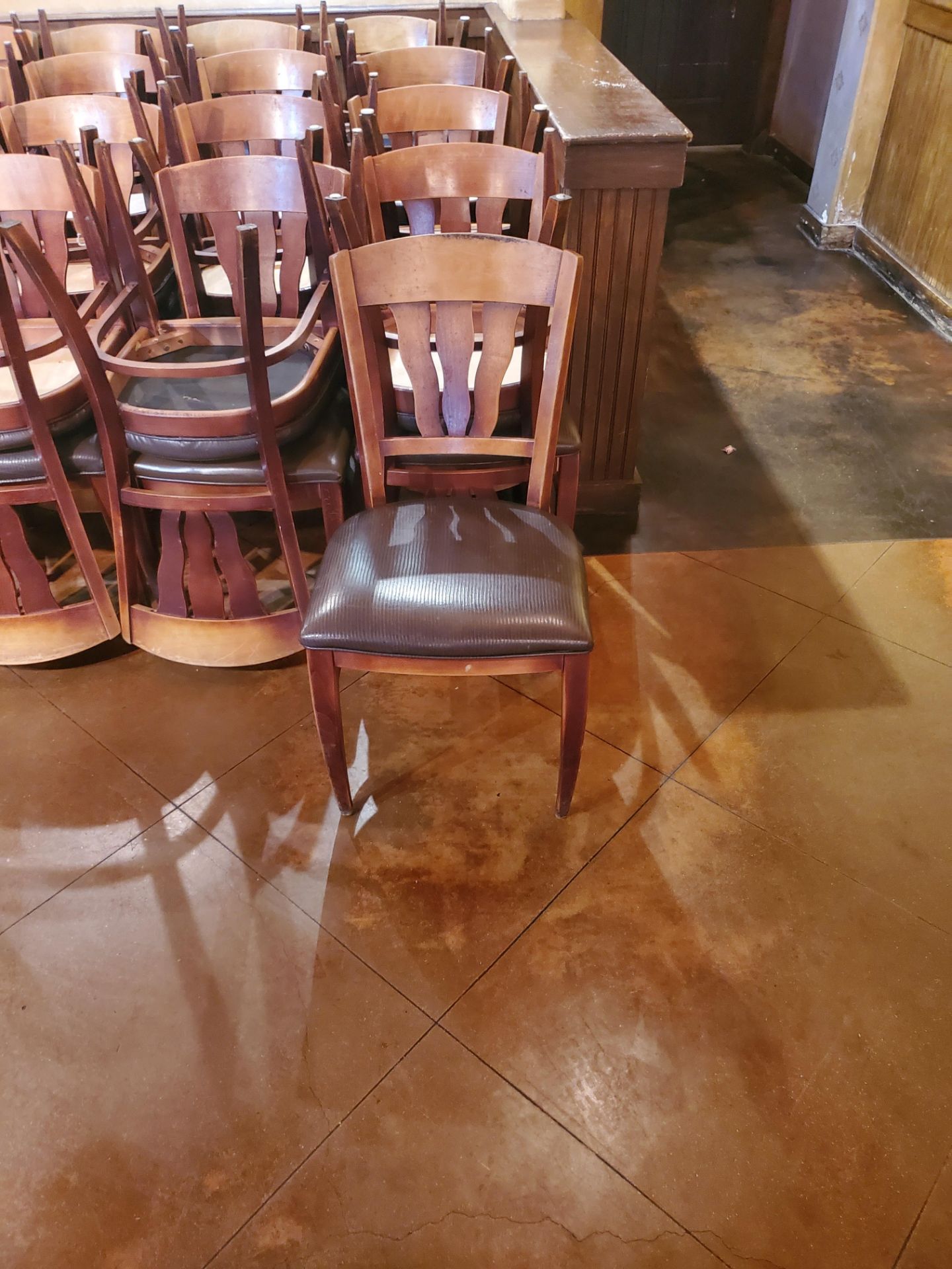 50 WOODEN RESTAURANT CHAIRS SUBJECT TO COUNT AND SOLD BY THE PIECE