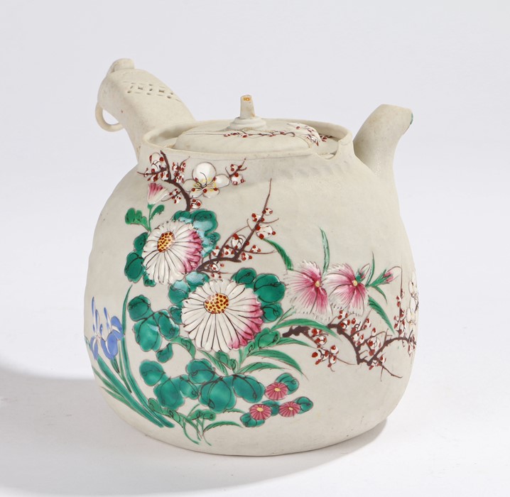 Japanese teapot, the body with polychrome foliate decoration, the side handle with ring finial,