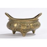 Chinese brass censer, with arched handles and dragon design to the body with a six character mark to