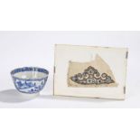 19th Century Chinese finely stitched silk fragment, 100mm x 50mm and a tea bowl decorated with