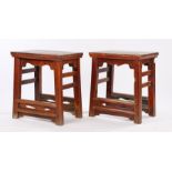 Pair of 19th Century Chinese stools, with rectangular tops above an undulating frieze and deep