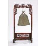 Chinese gong, with a bell shaped foliate decorated gong held within the fretwork frame, the frame