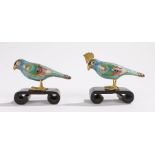 Two Chinese cloisonne birds, with blue bodies and foliate multicoloured decoration, 8cm wide, (2)