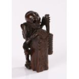 Japanese Meiji period netsuke, the wood netsuke carved as Otsuyu from a ghost play, depicted as a