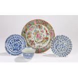 Chinese tea bowl and two saucers decorated with flowers and foliage, one saucer and tea bowl with