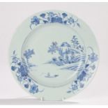 Chinese Qianlong plate decorated with a rocky landscape, fisherman in a boat and flowers, 23cm