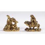 Pair of Chinese gilt bronze figures, depicting a lady seated on a stag and a gentleman seated on a