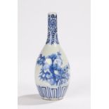 Chinese porcelain vase, in blue and white with a slender neck above a tree decorated body,