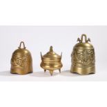 Two Chinese brass bells, the bells decorated with dragons pursuing the pearl of wisdom and a