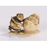 Japanese Meiji period ivory netsuke of a Karako and Daruma, a comical depiction of the Daruma as a