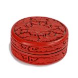 Chinese Qing cinnabar lacquer box, the circular lidded box decorated to the sides and lid with