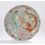 Japanese porcelain charger, the central field with depiction of a dragon and peacock amongst