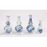 Four miniature Chinese vases, each decorated with flowers in blue and white, 5cm up to 7.5cm, (4)