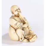 Japanese Meiji period ivory netsuke, carved as a figure playing an instrument, 5cm high