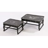Nest of two Chinese black lacquer occasional tables, with foliate and butterfly inlaid mother of