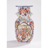 Japanese imari pattern vase, the wavy rim above two monkey form handles and raised dragon