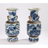 Pair of Chinese vases, the crackled bodies with blue and white foliate decoration, 44cm high