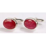 Pair of oval ruby silver mounted cufflinks, stamped 925
