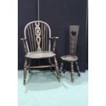 Windsor wheel back elbow chair with solid dished seat, on turned legs and stretchers, Welsh love