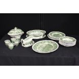 Adams English ironstone part dinner service, transfer decorated in green with landscape scenes (