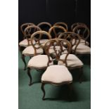 Set of six Victorian mahogany balloon back dining chairs, with pierced scroll carved cresting rails,