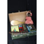 Metal mounted suitcase, containing children's books, souvenir knife and fork in a fish form