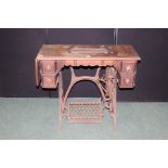 Treadle sewing machine table, with four drawers and leaf, on a cast iron frame, 87cm wide