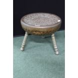 Middle Eastern brass stool, the circular seat decorated with birds amongst foliage, raised on