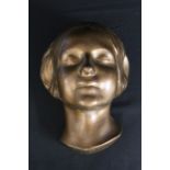 Copy of death mask of the face of a young girl who drowned in the river Seine in Paris during the