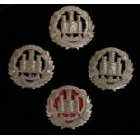 Four WW1 economy cap badges to the Northamtonshire Regiment, sliders to the reverse, marked WD