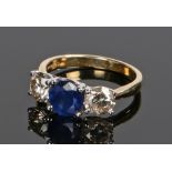 18 carat gold diamond and sapphire set ring, the central sapphire at approximately 1.41 carat