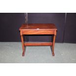 Mahogany veneered organ/piano stool, the hinged lid opening to reveal an interior compartment, on