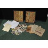 Cigarette cards sorted into sets, two frames containing cigar bands, matchbox labels etc. (qty)