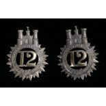 Two 12th Regiment of Foot (Suffolk Regiment) glengarry badges, two loops to the reverse,