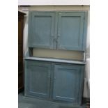 Pine dresser, painted turquoise, with two panelled cupboard door above an open recess and a