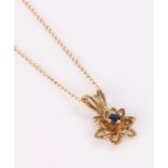 10 carat gold pendant necklace, in the form of a star with sapphire