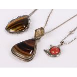 Jewellery, to include a tigers eye pendant, an agate example and a another, (3)