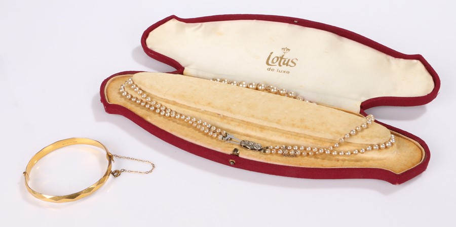 Lotus cased necklace, together with a bracelet, (2)