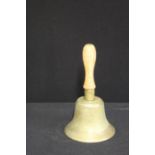 Brass bell, stamped "FIDDIAN", with turned wooden handle