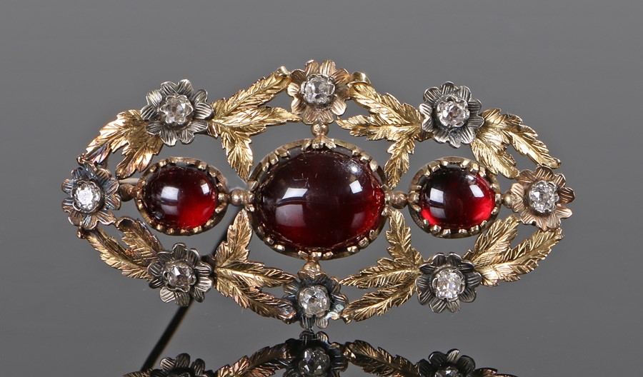 Victorian garnet and diamond set brooch, the cabochon trio of garnets with eight diamonds set to