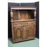 17th Century style oak court cupboard, with lunette carved frieze drawer above a small cupboard