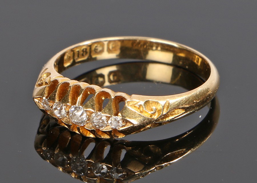 18 carat gold diamond set ring, with a row of five round cut diamonds, ring size L