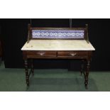 Edwardian mahogany washstand, with blue and white tiled splash back above a grey veined marble