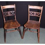 Pair of Victorian dining chairs, with curved cresting rails, pierced roundel carved splat back,